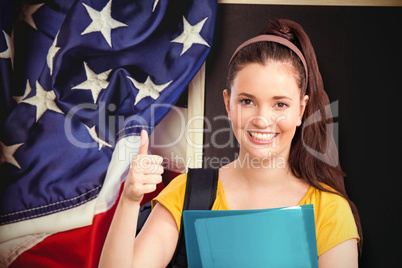 Composite image of student with thumbs up