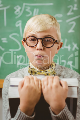 Pupil dressed up as teacher holding books