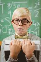 Pupil dressed up as teacher holding books