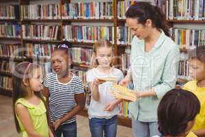 Pupils and teacher in the library