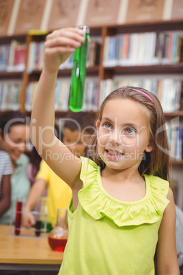 Pupil doing science in library