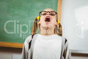 Cute pupil yelling in a classroom