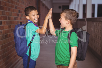 Pupils giving each other a high five