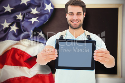 Composite image of student showing tablet Composite image of student showing tablet