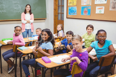 Students and teacher looking at the camera