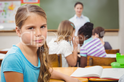 Pupil frowning at camera during class