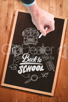 Composite image of hand writing with a white chalk