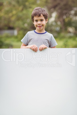 Cute pupil showing large poster