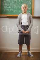 Pupil dressed up as teacher in front of chalkboard