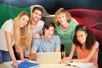 Composite image of college students using laptop in library