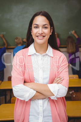 Teacher standing with students at blackboard