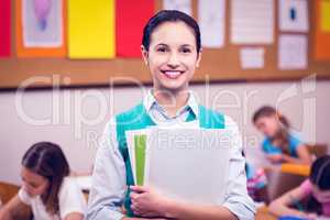 Teacher smiling at camera in classroom