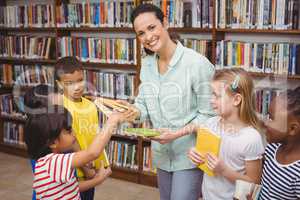 Pupils and teacher in the library