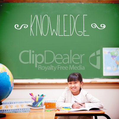 Knowledge against cute pupil sitting at desk