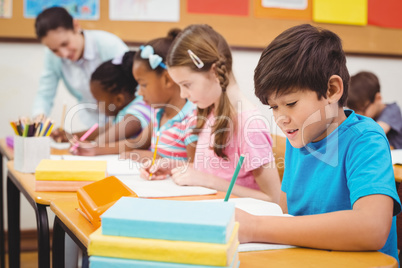 Pupils working at their desks in class