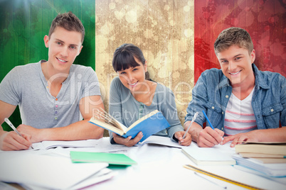 Composite image of students doing work together as they all look
