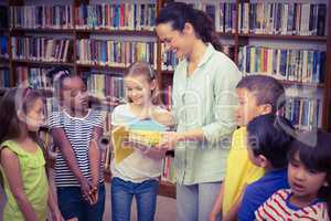 Pupils and teacher in the library