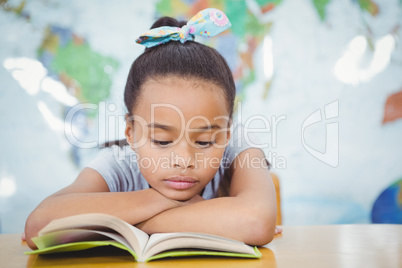 Student reading from a school book