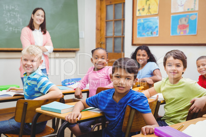 Students and teacher looking at the camera