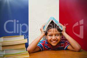 Composite image of pupil with many books