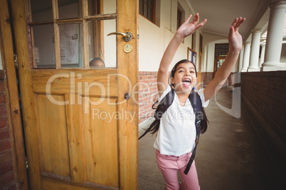 Happy pupil running on the corridor