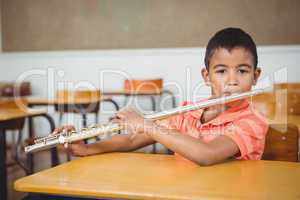 Student using a flute in class