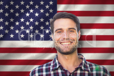Composite image of happy young man in the park