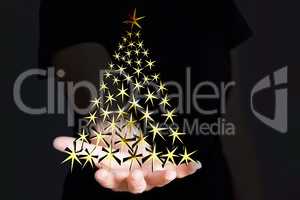 Hand holding Christmas tree made of stars