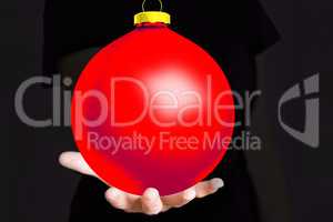 Hand holding Christmas bauble