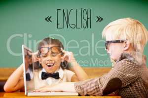 English against cute pupils dressed up as teachers in classroom