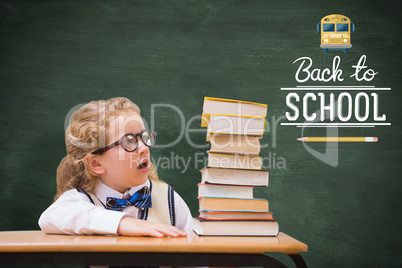 Composite image of surprise pupil looking at books