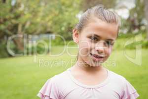 A Smiling kid standing outside