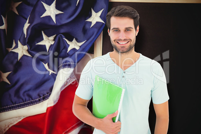 Composite image of student holding notepad