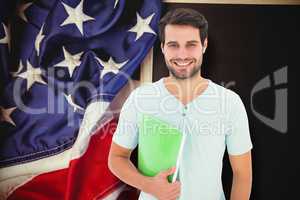 Composite image of student holding notepad