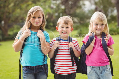Smiling classmates with schoolbags Smiling classmates with schoolbags