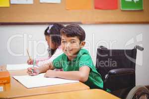 Smiling student sitting in wheelchair