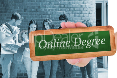 Online degree against happy students standing and reading