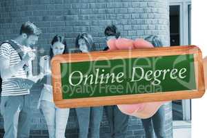 Online degree against happy students standing and reading