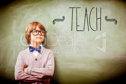 Teach against boy with arms crossed looking up at blackboard
