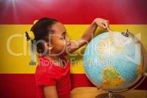 Composite image of happy pupil with globe