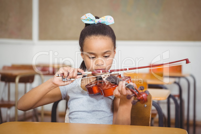 Student using a flute in class