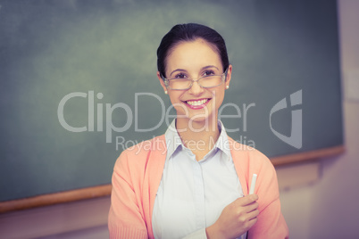 Teacher smiling at camera in classroom