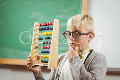 Pupil dressed up as teacher holding abacus