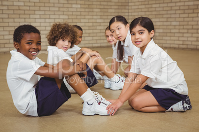 Students helping other students exercise