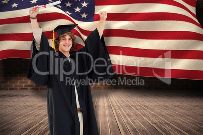 Composite image of male student in graduate robe raising his arm