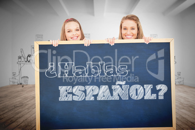 Composite image of close up of young women behind a blank sign