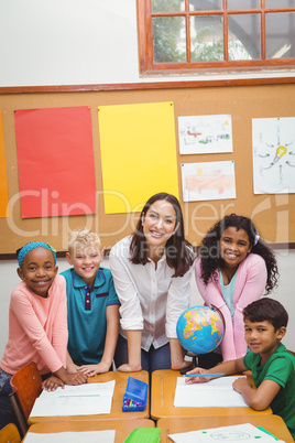 Students and teacher looking at the camera