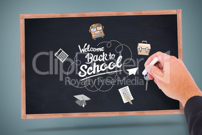 Composite image of hand writing with chalk