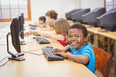 Smiling student using a computer