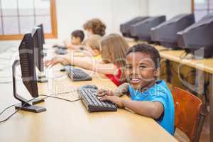 Smiling student using a computer